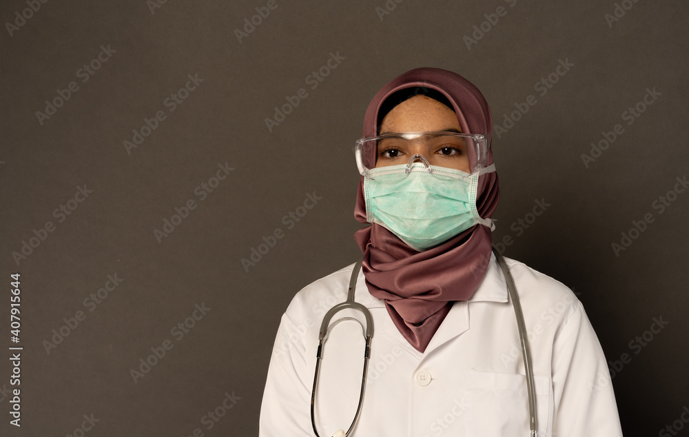 Researcher wearing protection with grey background. Researcher wearing protection with grey background.