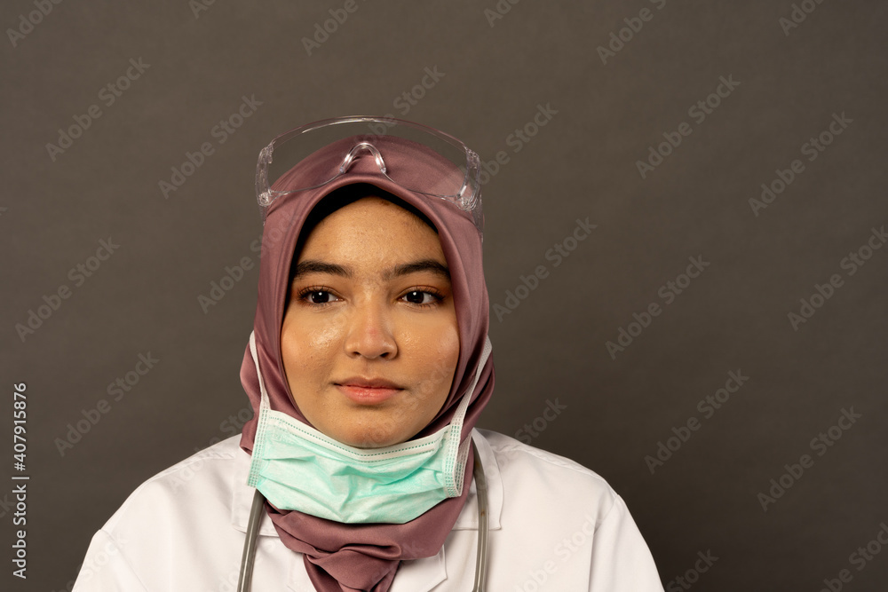 Researcher wearing protection with grey background. Researcher wearing protection with grey background.