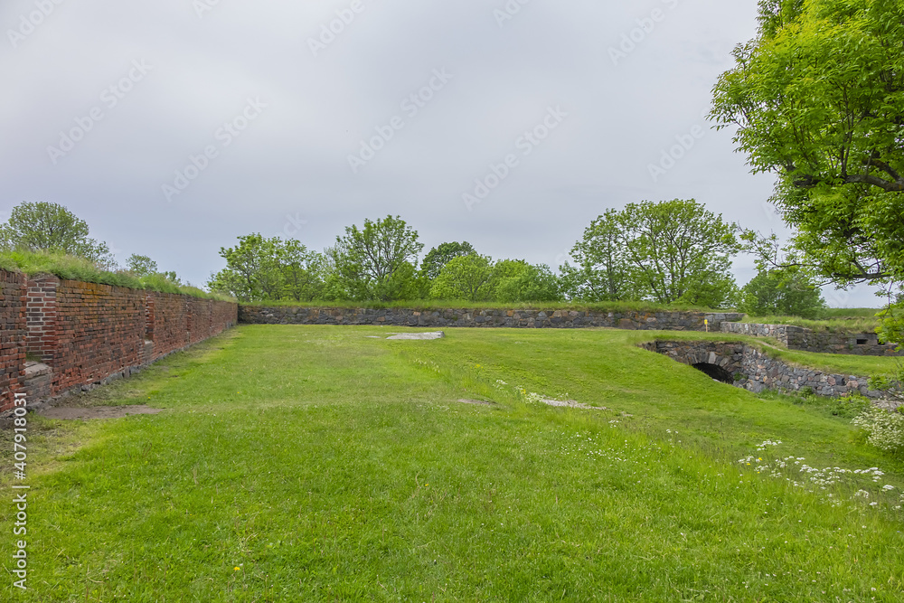 Fototapeta premium Beautiful landscape at Suomenlinna fortress. Suomenlinna (Sveaborg) - sea fortress, which built gradually from 1748 onwards on a group of islands belonging to Helsinki district. Helsinki, Finland.