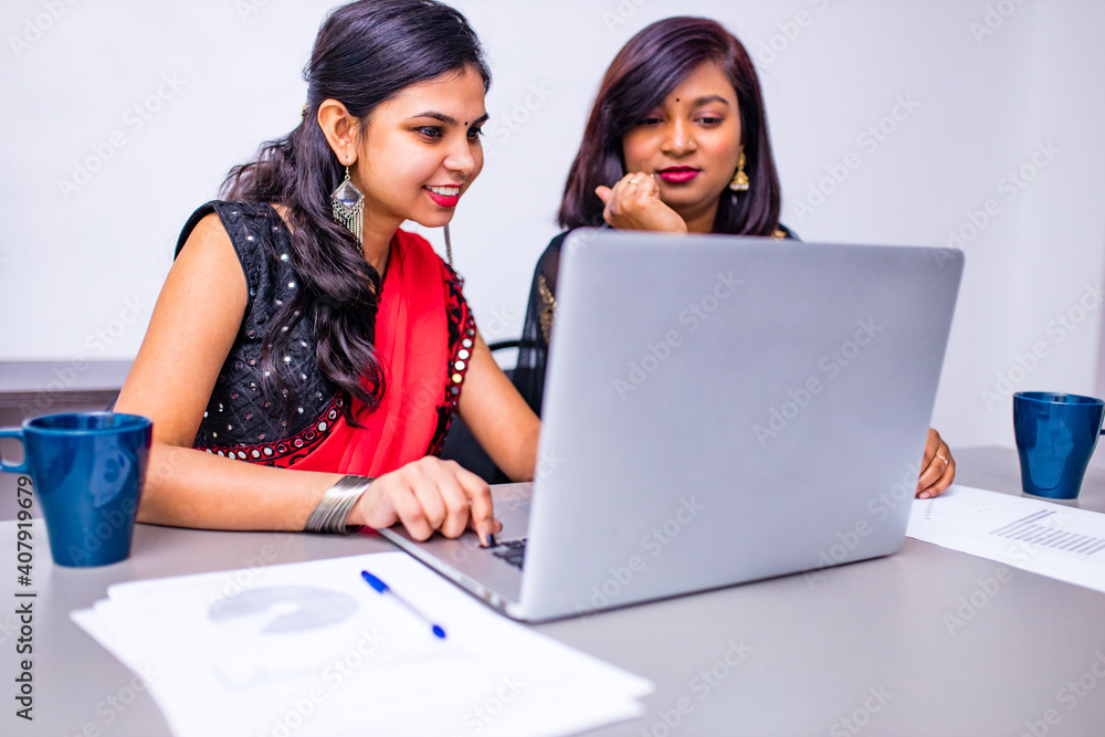 two beautiful women in tradition sari working at office or cafe two beautiful women in tradition sari working at office or cafe