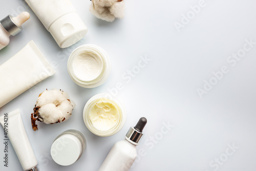 Flat lay composition with skin care products on white background