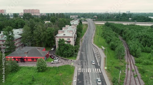 Two police cars are driving on the highway. Aerial view.