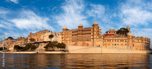 Panoramic view of the Udaipur City Palace from lake Pichola in Rajasthan, India