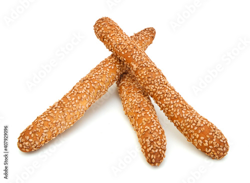Baking bread with sesame stick isolated on the white background