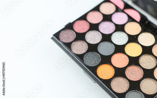 Multicolored eye shadows palette isolated on white. Soft shadow