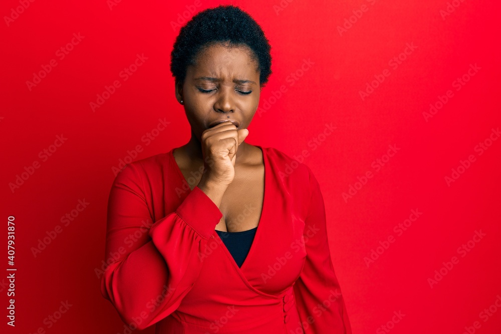 Young african woman with afro hair wearing casual clothes over red background feeling unwell and coughing as symptom for cold or bronchitis. health care concept. Young african woman with afro hair wearing casual clothes over red background feeling unwell and coughing as symptom for cold or bronchitis. health care concept.