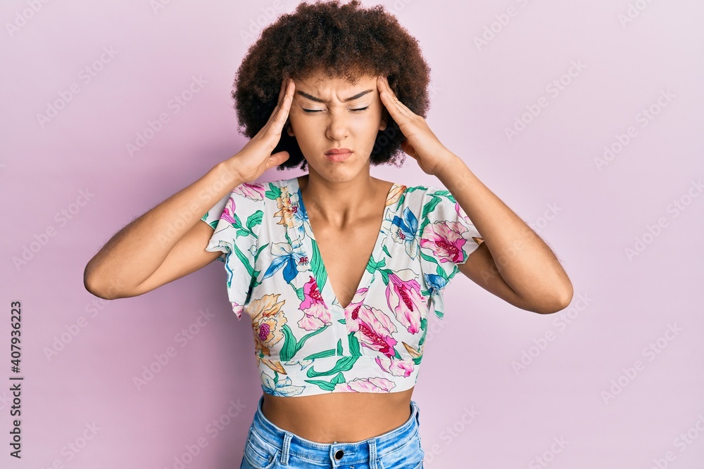 Young hispanic girl wearing summer style with hand on head, headache because stress. suffering migraine. Young hispanic girl wearing summer style with hand on head, headache because stress. suffering migraine.