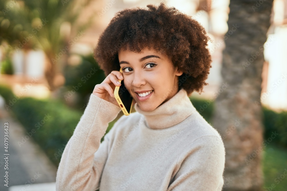 Young hispanic girl smiling happy talking on the smartphone at the park. Young hispanic girl smiling happy talking on the smartphone at the park.