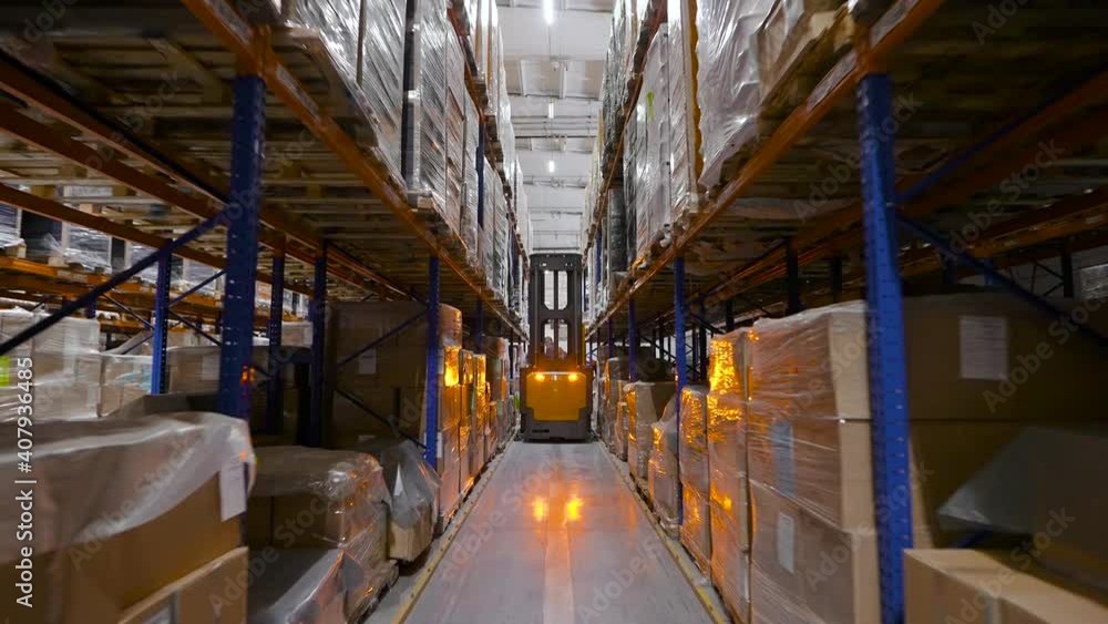 A huge warehouse filled with packed pallets. Logistics and storage of a large volume of goods. A huge warehouse filled with packed pallets. Logistics and storage of a large volume of goods.