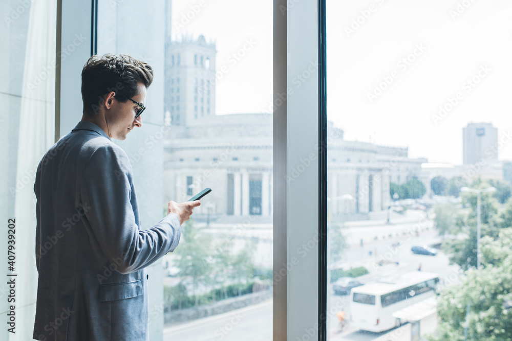 Serious businessman using smartphone in office Serious businessman using smartphone in office