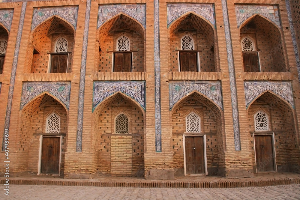 Khiva, Uzbekistan - December 02 2019: Historic architecture of Itchan Kala, walled inner town. UNESCO World Heritage Site.