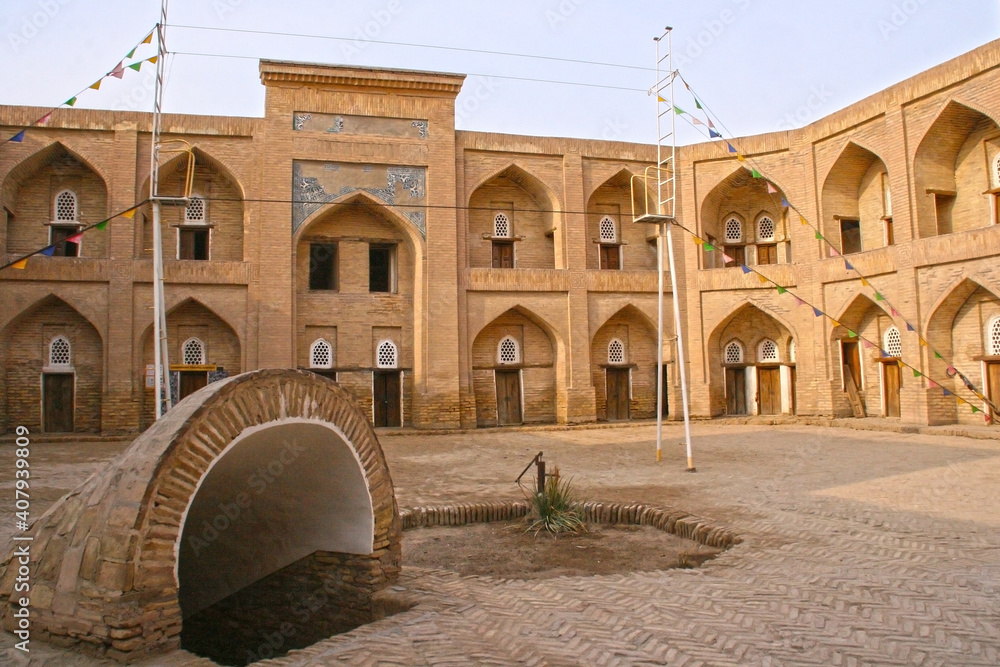 Khiva, Uzbekistan, December 02 2019: The exterior of the Qutlugh Murad Inaq Madrassa. UNESCO heritage site.