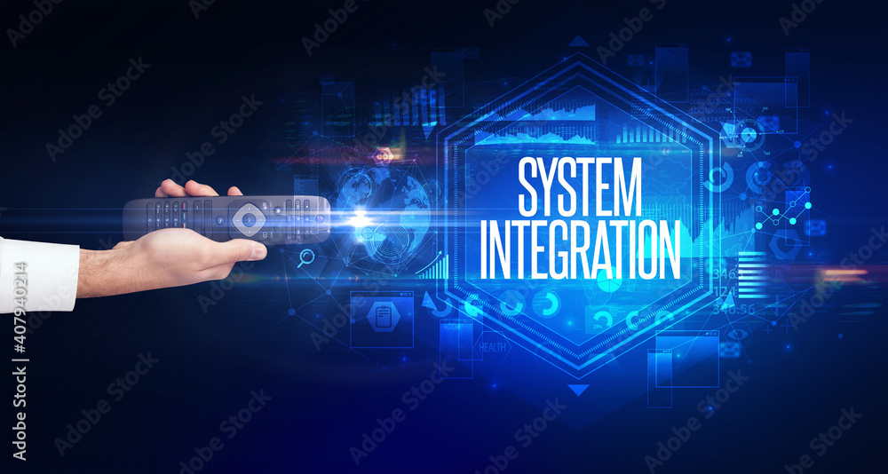 hand holding wireless peripheral with SYSTEM INTEGRATION inscription, cyber security concept hand holding wireless peripheral with SYSTEM INTEGRATION inscription, cyber security concept