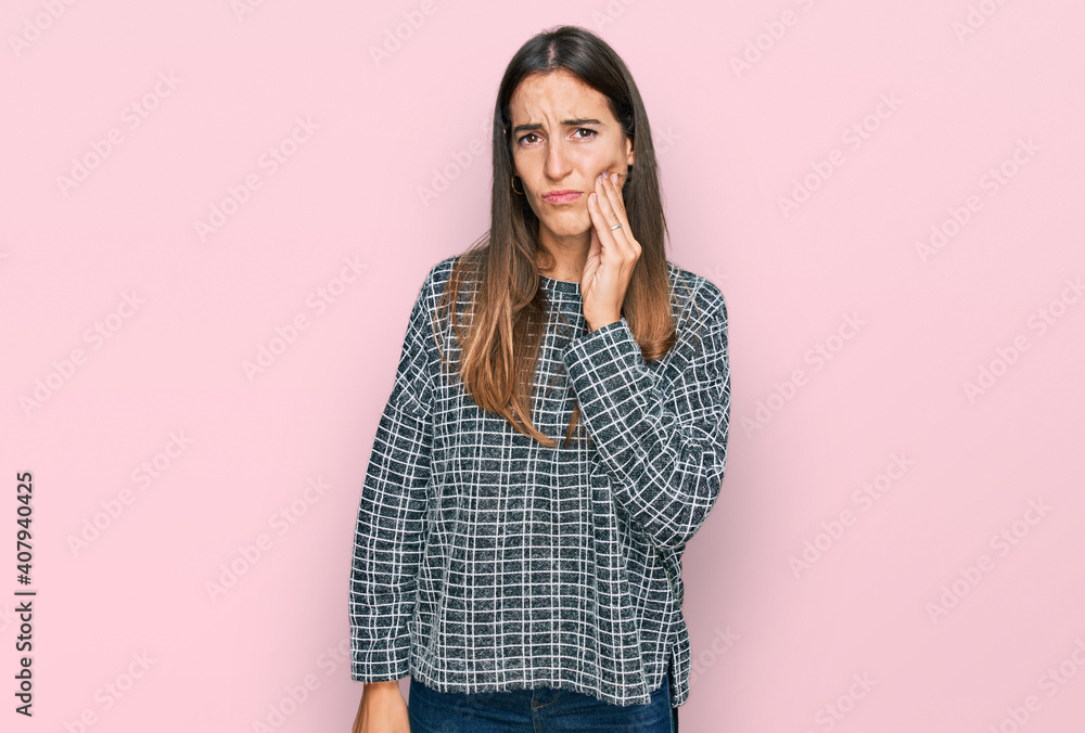 Young beautiful woman wearing casual clothes touching mouth with hand with painful expression because of toothache or dental illness on teeth. dentist Young beautiful woman wearing casual clothes touching mouth with hand with painful expression because of toothache or dental illness on teeth. dentist