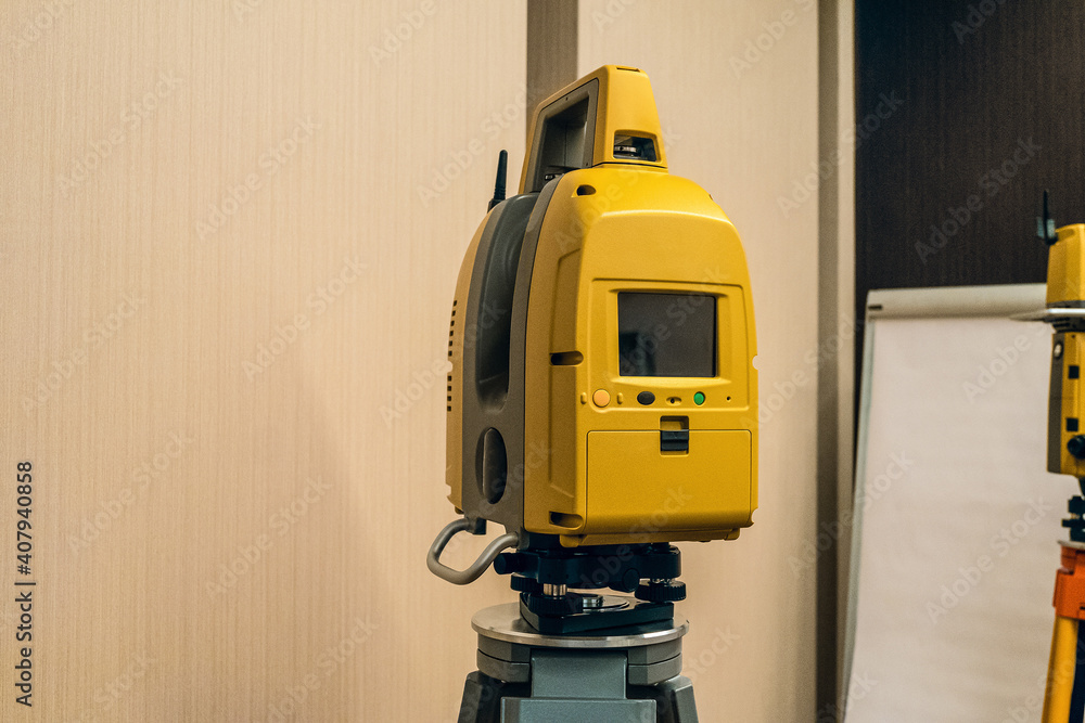 Geodetic Instrument Yellow electronic total station. Modern geodetic instrument for ...