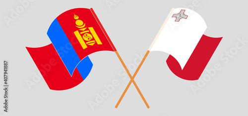 Crossed and waving flags of Mongolia and Malta