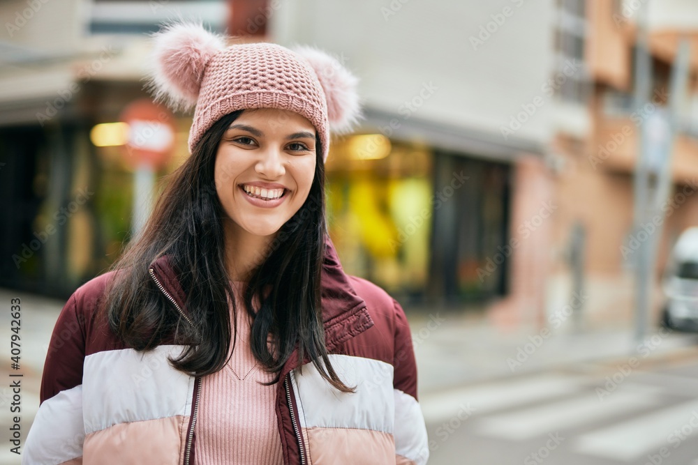 Young hispanic girl smiling happy standing at the city. Young hispanic girl smiling happy standing at the city.