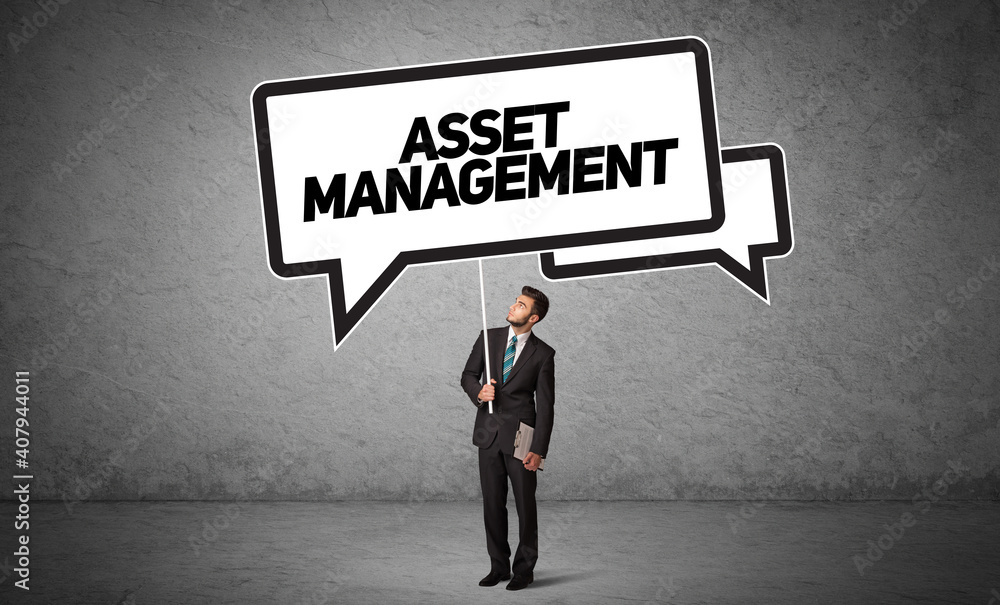 Young business person in casual holding road sign with ASSET MANAGEMENT inscription, new business idea concept Young business person in casual holding road sign with ASSET MANAGEMENT inscription, new business idea concept