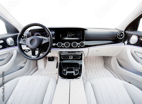 Luxury car interior. Steering wheel, shift lever and dashboard. white leather interior with black dashboard. on an isolated white background
