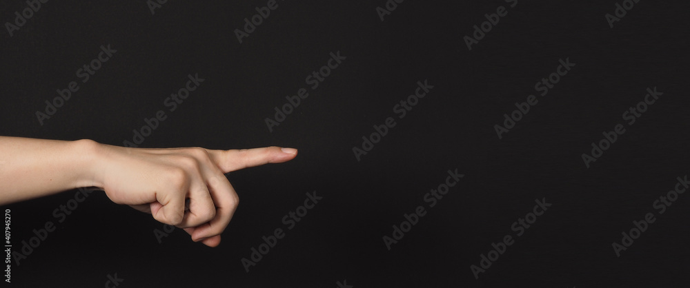 Index finger pointing to something, isolated on black background.
