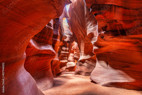 Beautiful wide angle view of sandstone formations in famous Antelope Canyon on a sunny day filtering light rays, Page, American Southwest, Arizona, USA.