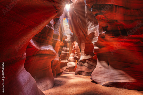 Beautiful wide angle view of sandstone formations in famous Antelope Canyon on a sunny day filtering light rays, Page, American Southwest, Arizona, USA.