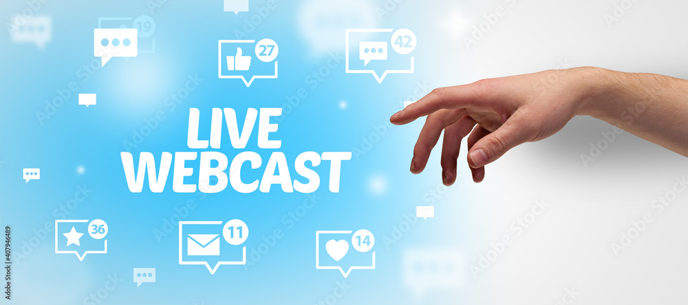 Close-Up of cropped hand pointing at LIVE WEBCAST inscription, social networking concept Close-Up of cropped hand pointing at LIVE WEBCAST inscription, social networking concept