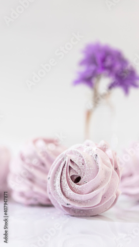 Handmade marshmallow with blueberries, white background. Violet Marshmallow, Meringue, Zephyr.