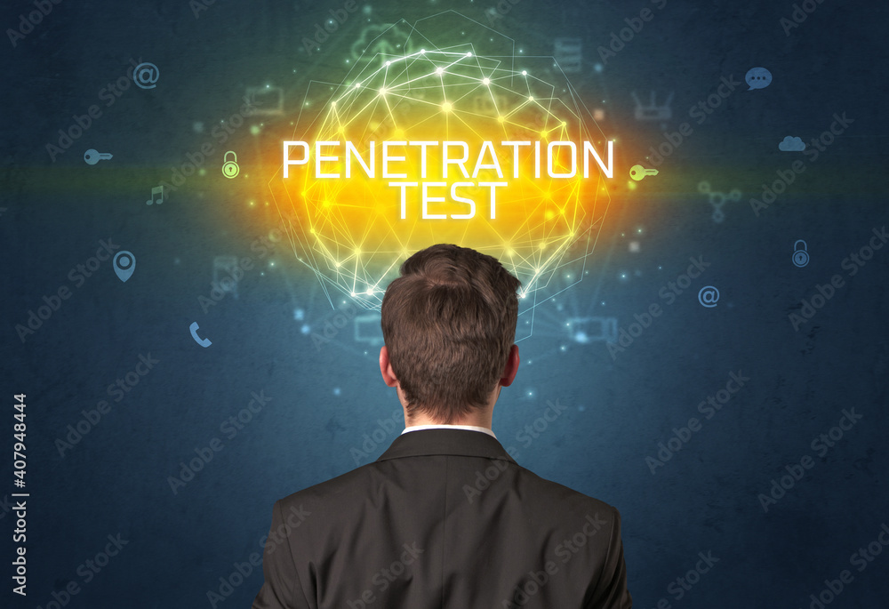 Rear view of a businessman with PENETRATION TEST inscription, online security concept Rear view of a businessman with PENETRATION TEST inscription, online security concept