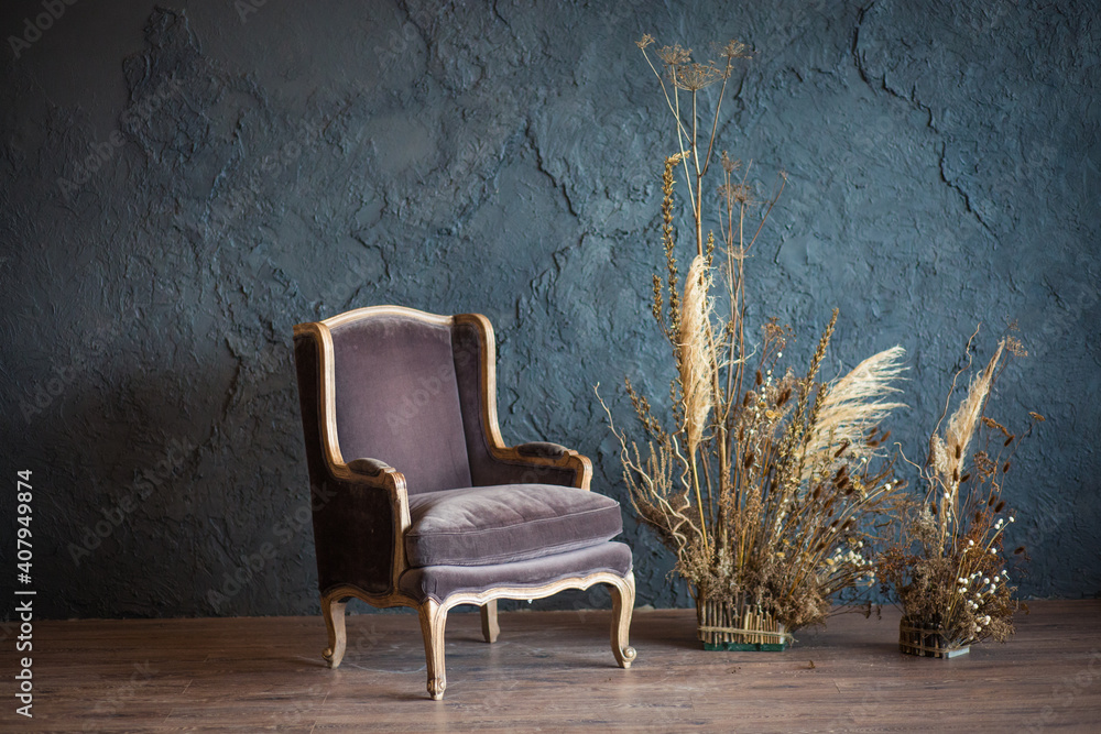 armchair in the interior against a gray wall