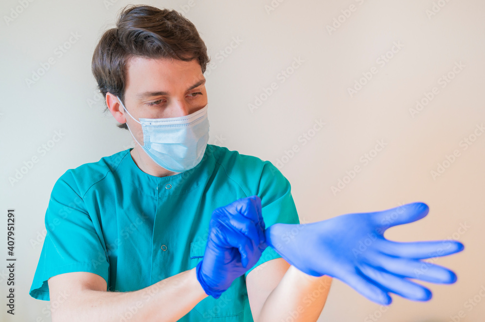 Doctor wearing gloves to work in the hospital Doctor wearing gloves to work in the hospital