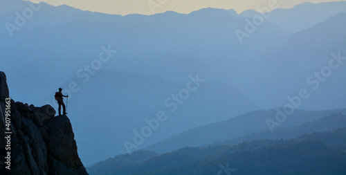 silhouette of mountaineer watching the mountains