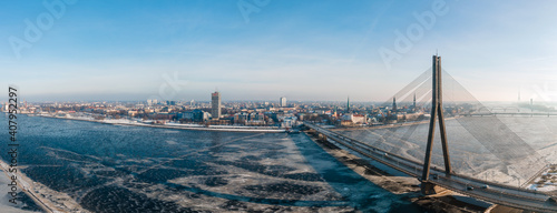 Aerial Panorama view of the Vansu bridge and Old Riga over Daugava river in Winter photo
