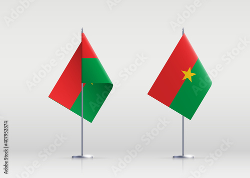 Burkina Faso flag state symbol isolated on background national banner. Greeting card National Independence Day of the Republic of Burkina Faso. Illustration banner with realistic state flag.