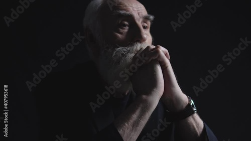 Worried company director thinking about business problem on dark background
