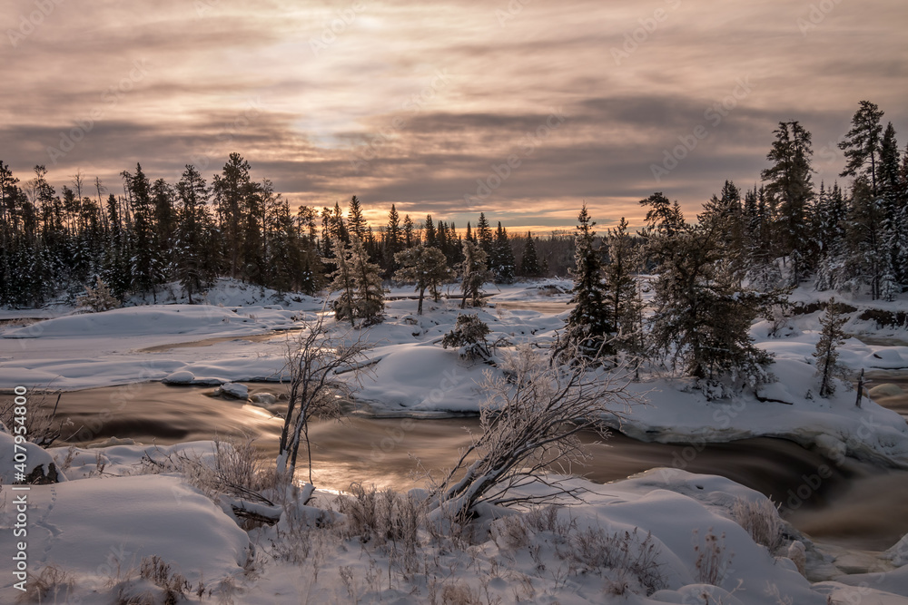 A snowy and frosty winter morning at a waterfall on the Wabigoon River, Northwest Ontario, Canada. A snowy and frosty winter morning at a waterfall on the Wabigoon River, Northwest Ontario, Canada.