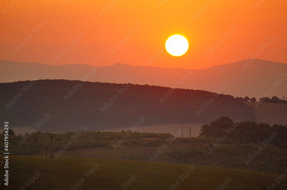 Beautiful colorful summer sunrise at picturesque hilly Slovak countryside Beautiful colorful summer sunrise at picturesque hilly Slovak countryside