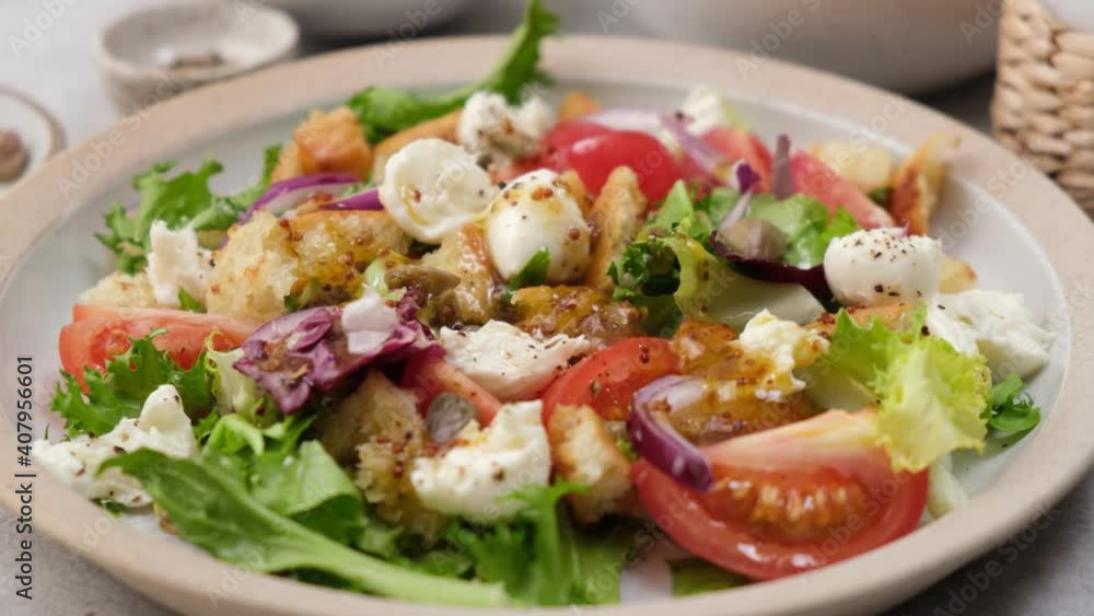 Honey mustard salad dressing. Chef pouring thick honey mustard olive oil dressing over healthy vegetable salad Honey mustard salad dressing. Chef pouring thick honey mustard olive oil dressing over healthy vegetable salad