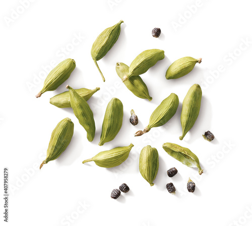 Cardamom pods and seeds isolated on white background top view photo