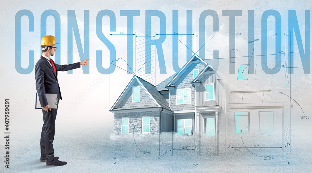Young engineer holding blueprint with CONSTRUCTION inscription, house planning concept Young engineer holding blueprint with CONSTRUCTION inscription, house planning concept