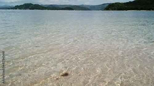  tropical vacation and island hopping concept. Gilli air island and Lombok . Indonesia, south Gili islands. Gili Asahan island. A strip of sand on the beach and blue sea with corals photo