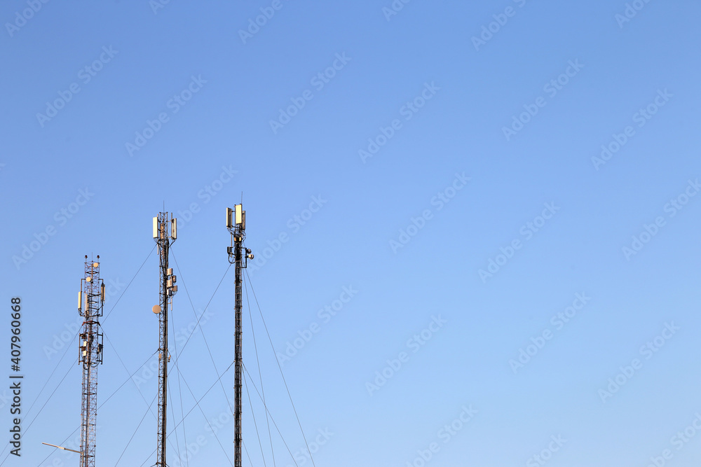 Obraz premium three antennas against the sky