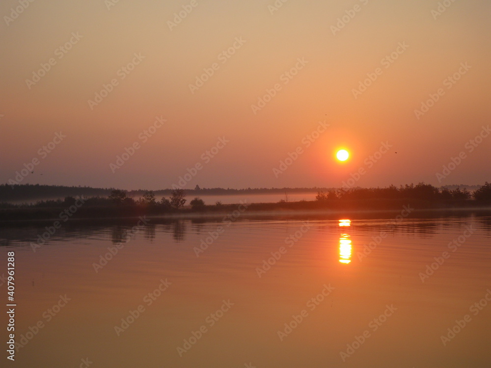 Sunrise over the river. Sun rising over nature reserve Ptasi Raj, Gdańsk, Poland