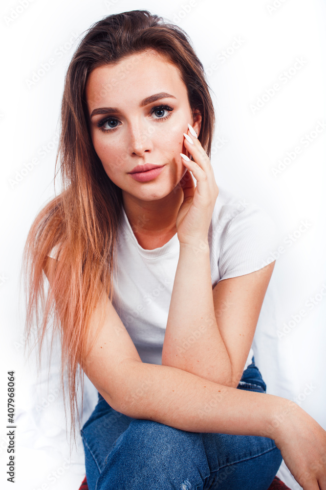 Fototapeta premium young blond woman on white backgroung gesture thumbs up, isolated emotional posing