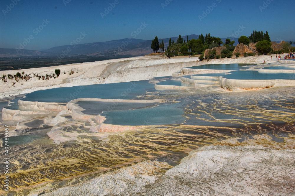 Panoramic view of the ancient Roman baths of Pamukkale (Anatolia, Turkey). Next to the Roman ruins of Hierapolis. Natural terraces. Panoramic view of the ancient Roman baths of Pamukkale (Anatolia, Turkey). Next to the Roman ruins of Hierapolis. Natural terraces.