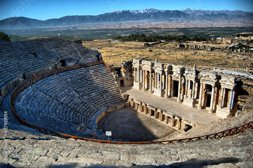 Panoramic view of the ancient Roman ruins of the theater of Hierapolis (Anatolia, Turkey). Next to the natural hot springs of Pamukkale.  photo