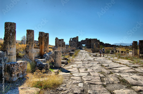 Panoramic view of the ancient Roman ruins of Hierapolis (Anatolia, Turkey). Next to the natural hot springs of Pamukkale.  photo