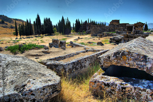 Panoramic view of the ancient Roman ruins of Hierapolis (Anatolia, Turkey). Next to the natural hot springs of Pamukkale. Necropolis. Tombs photo