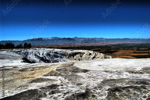 Panoramic view of the ancient Roman baths of Pamukkale (Anatolia, Turkey). Next to the Roman ruins of Hierapolis. Natural terraces. "Cotton castle"