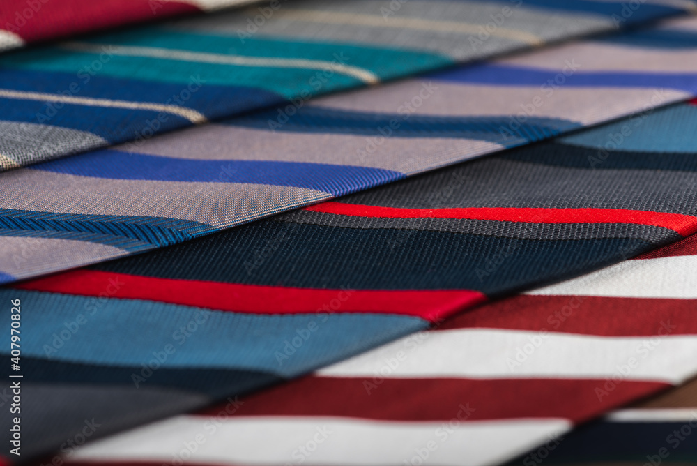 close-up view, many colorful folded ties, sloping horizon close-up view, many colorful folded ties, sloping horizon